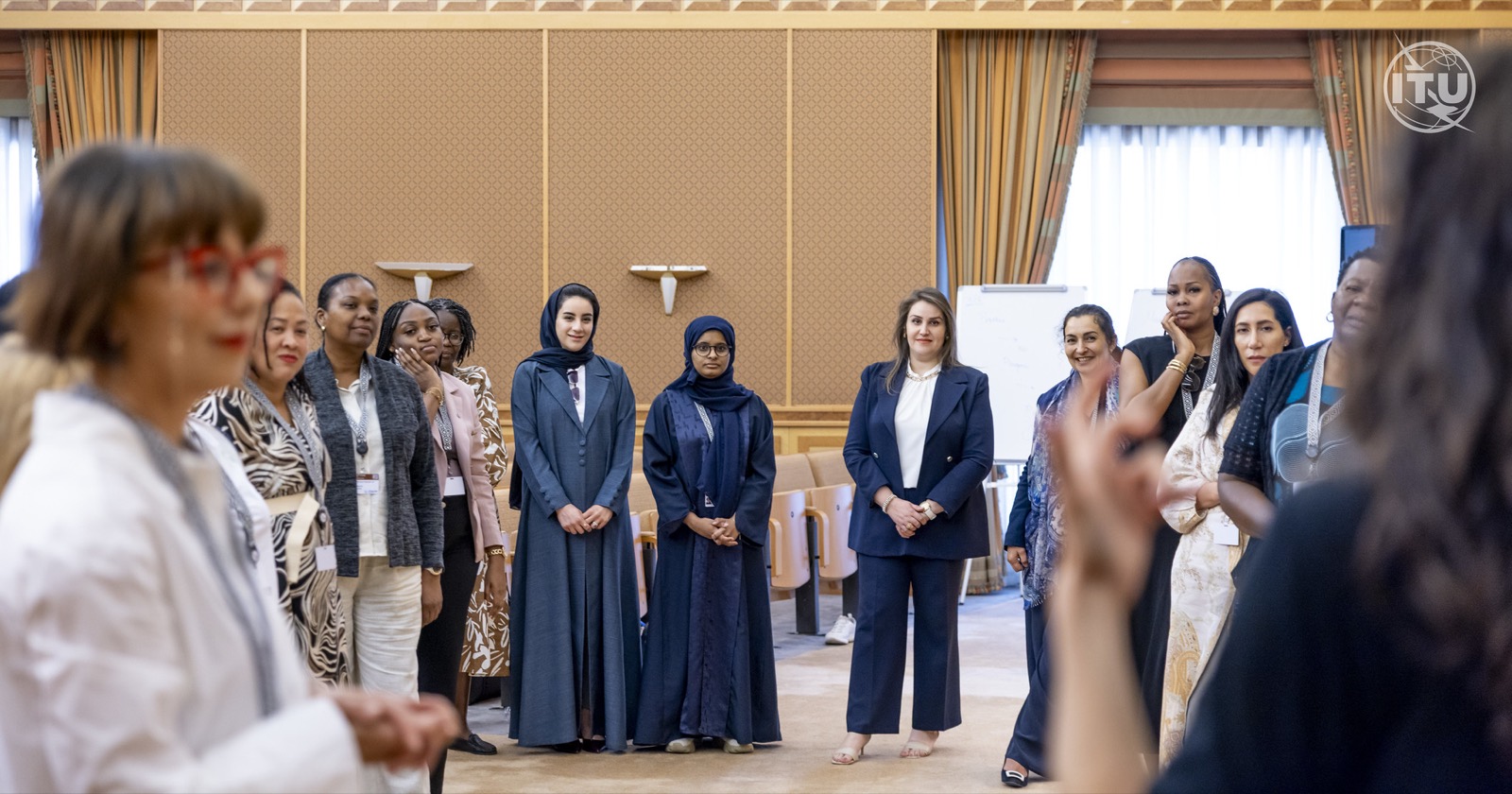Women leaders standing in a circle during an interactive confidence exercise