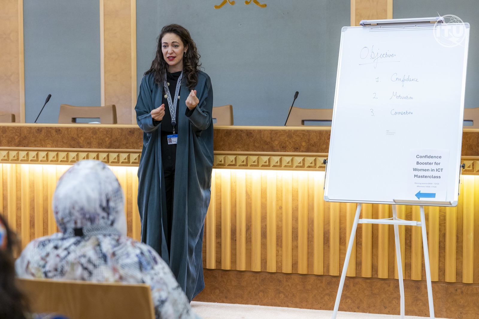 Lucy Antrobus teaching beside a flip chart during a confidence masterclass